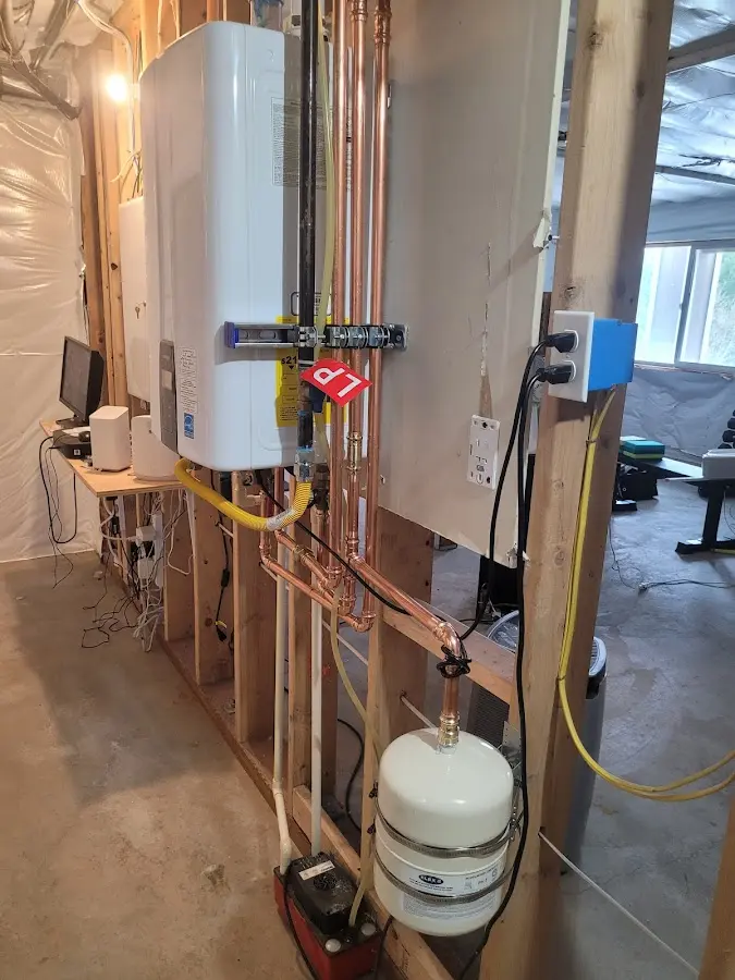 Licensed plumber repairing a kitchen sink in Howard