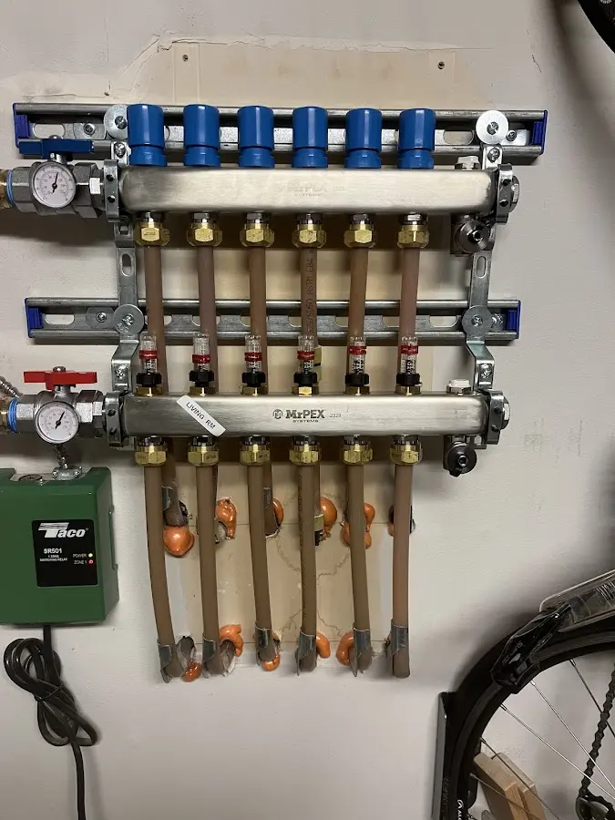 Plumber performing Water Heater Repair at a residential property in Howard